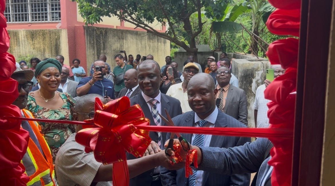 Cutting the ribbon at the commissioning of the WASH facility, George Padmore Research Library, Accra